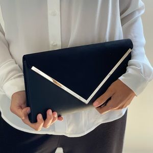 Black clutch with gold chain from Aldo. 11 inches long. Suede & gold detailing